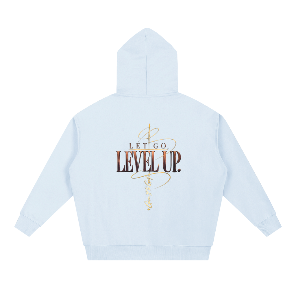 Give It To God oversized hoodie in light blue with metallic gold Let Go. Level Up. graphic on the back.